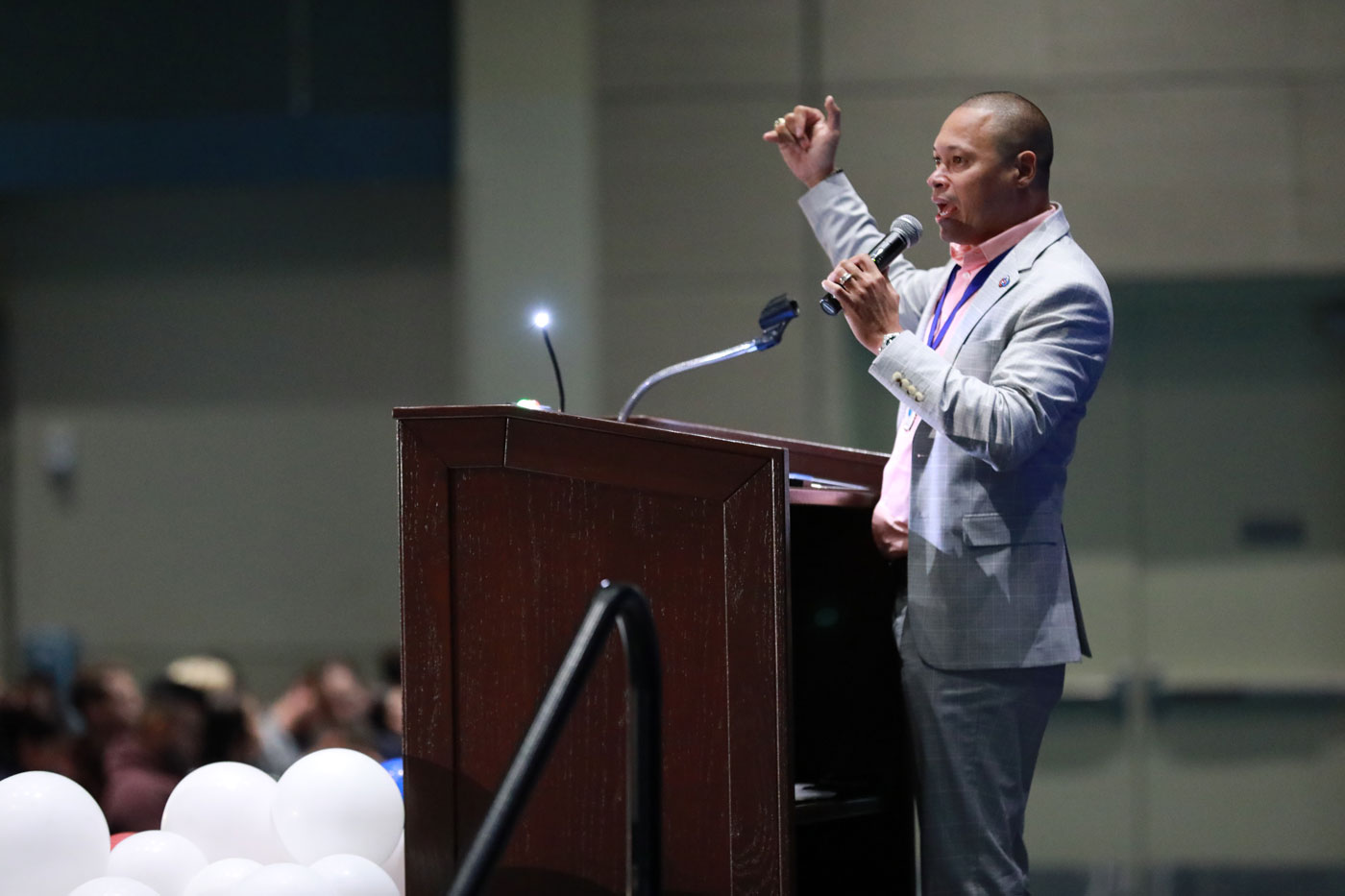 Primerica leader speaking to attendees behind a podium