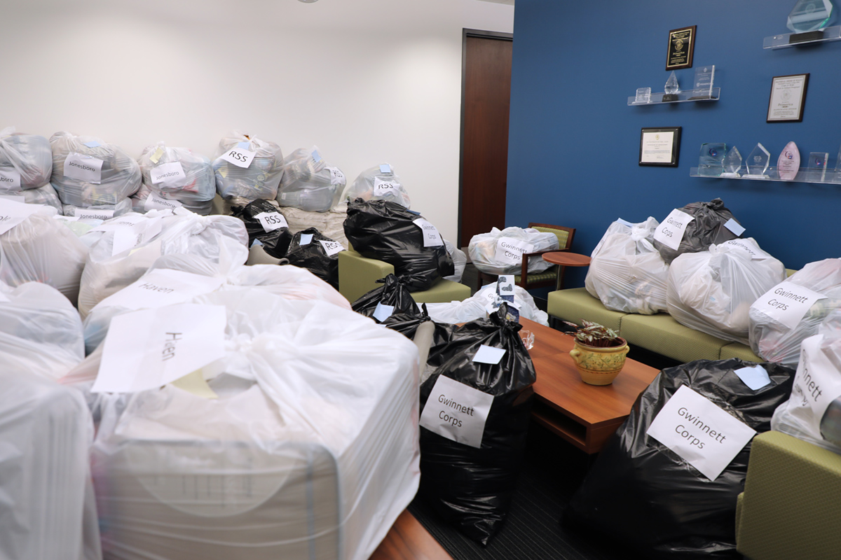 Photo of bags and boxes of blankets in office area