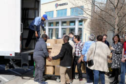 Photo of employees loading a Salvation Army truck